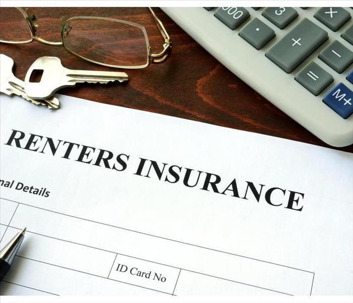 Renters insurance form and dollars on the table